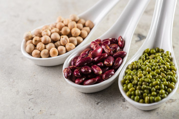 mix of beans on wooden table