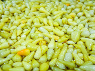 hot yellow pickles pepper background