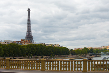 Fototapeta na wymiar Eiffel Tower Cityscape View from Bridge Over Seine River in Paris, France
