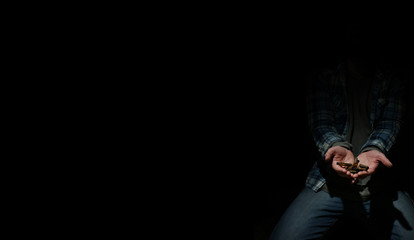 black background with bullet in hands man