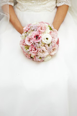 Bride holding wedding bouquet 