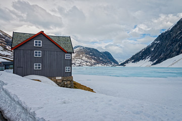 Frozen Djupvatnet lake on the road #63 to Geiranger fjord, Norway.