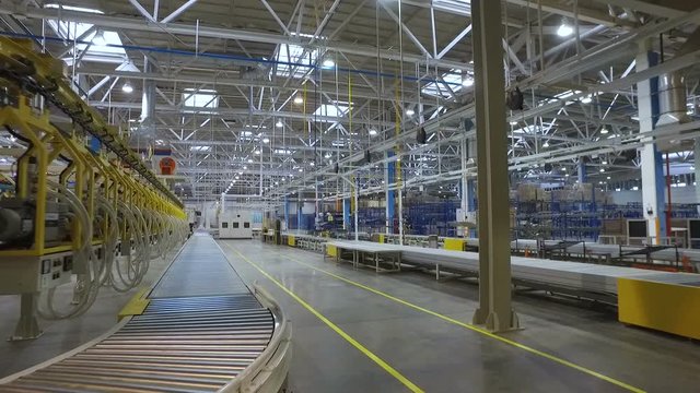 Huge Spacious Factory with  Metal Structures at Top