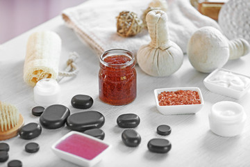 Spa treatments on white table in salon