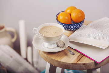 Still life details,cozy concept, warm candles, coffee, newspaper