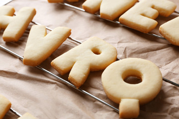 Cookie alphabet on crumpled paper, closeup
