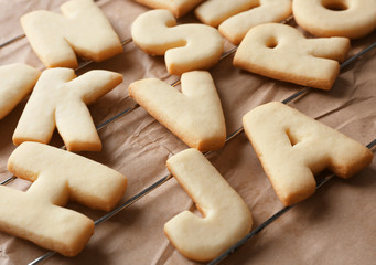 Cookie alphabet on crumpled paper, closeup