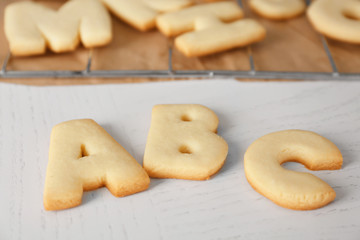 Cookie alphabet on crumpled paper, closeup