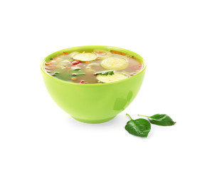 Bowl with vegetable soup on white background