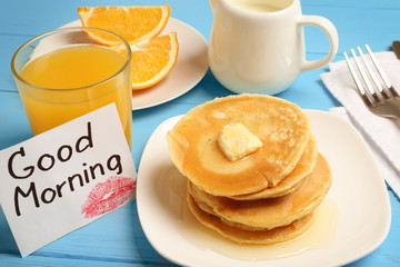 Tasty breakfast and note GOOD MORNING on kitchen table