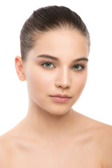 Obraz premium Portrait of beautiful young brunette woman with clean face. Beauty spa model girl with perfect fresh clean skin. Looking at camera and smiling. Youth and skin care concept. Isolated on a white