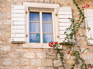 Fototapeta na wymiar Part of house of small typical town in mediterranian. Beautiful village, with cute details