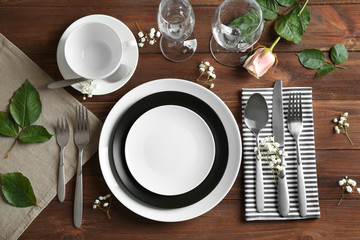 Beautiful festive table setting on wooden table - Powered by Adobe