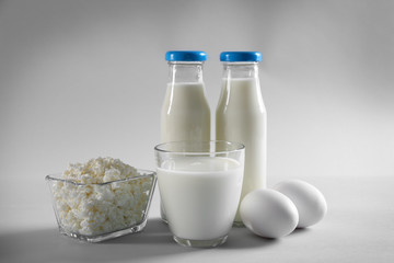 Different dairy products on light background