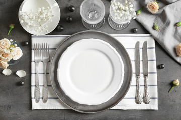 Beautiful table setting on grey background © Africa Studio
