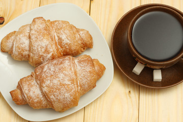 fresh croissant with coffee