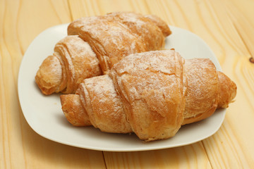 fresh croissant on wood