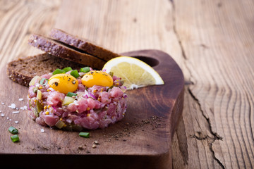 Steak tartare with two quail egg yolks on top