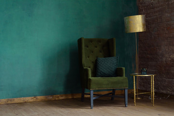 Interior of the living room with an armchair and a floor lamp