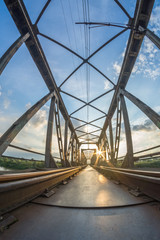 railway bridge at sunset - vertical frame of worms's-eye view with wide angle lens