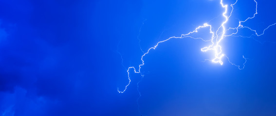Thunderstorms thunder lightning night sky clouds overcast summer rain, background panorama and with space for text