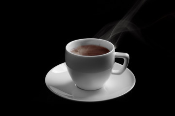 Steaming cup of coffee on black background