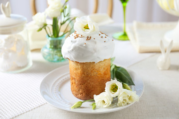 Plate with sweet Easter cake on table