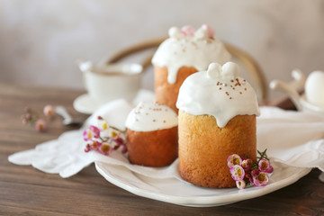 Plate with sweet Easter cakes on table