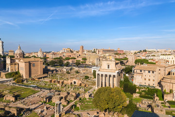 Fototapeta na wymiar Rome, Italy. Ruins of the Roman Forum: Curia Julia, the temple of the deified Julia, the temple of Vesta, the temple of Antoninus and Faustina