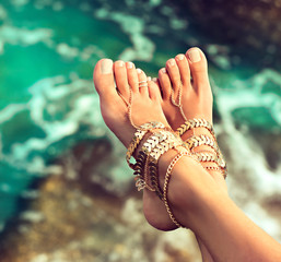 Woman In Relaxation On Tropical Beach with sand , body parts  . 