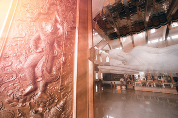White Reclining Buddha in Wat Pa Phu Kon,Thailand.