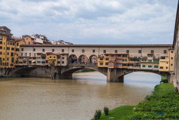 Fototapeta na wymiar Famous Ponte Vecchio bridge across the river Arno in Florence, Italy