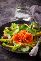 Vegetable salad with carrot, cucumber, pepper, almond and chick-pea