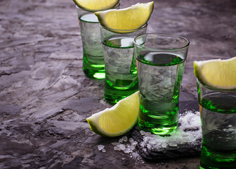 Shots of silver tequila with lime and salt