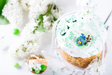 Traditional easter cake.Holiday.Decorated Fresh Flowers  Lily.Copy space for Text. selective focus.