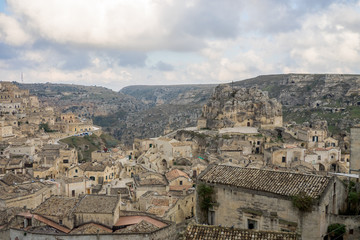 Fototapeta premium Panoramic view of Matera. Sassi and canyon in a cloudy day