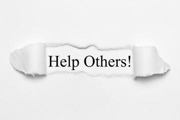 Help Others! on white torn paper