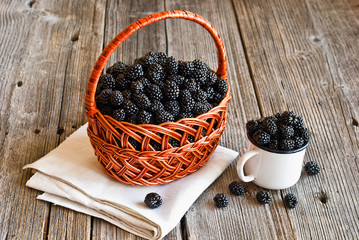 Fototapeta na wymiar blackberries on wooden rustic table
