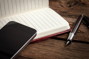 Blank notebook and ink pen.