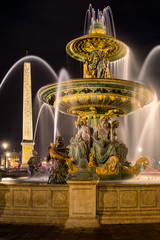 The Fountain of River Commerce and Navigation (Fontaine des Fleuves) and the obelisk at night. Place de la Concorde, Paris, France