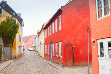 Fototapeta na wymiar Colorful living houses along street, Germany