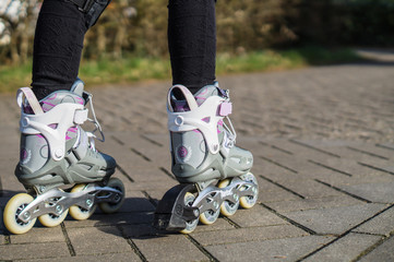 Children ride on inline skates on the street