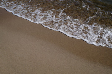 Soft wave of the ocean on the sandy beach