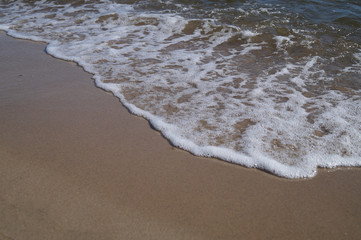 Soft wave of the ocean on the sandy beach