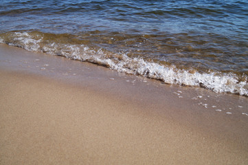Soft wave of the ocean on the sandy beach