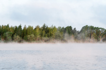 Fototapeta premium Morning fog on the lake, sunrise shot