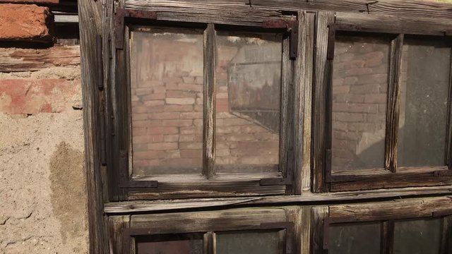 Wood and glass broken with destructed building facade 4K 2160p 30fps UltraHD footage - Old abandoned house weathered window details 3840X2160 UHD video 