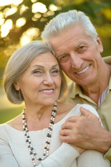 Happy elderly couple embracing