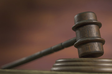 Law theme, mallet of the judge, wooden rustic desk, 