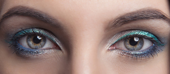 Obraz premium bright makeup for eyes open girls with clean skin. Three colors. Macro.